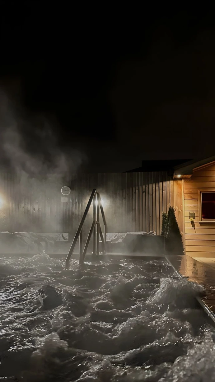 Outdoor thermal pool at night in Budapest spa hotel